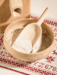 Corn mill and bowl of whole grain wheat flour - DISF001494