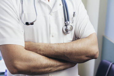 Medical doctor with a stethoscope standing in office Stock Photo by  ©lenetssergey 191087844