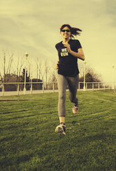 Spain, Gijon, Woman jogging in the city - MGOF000178