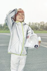 Boy dressed up as spaceman looking up - EDF000152