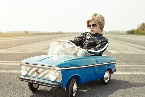 Cool boy in pedal car on race track - EDF000179
