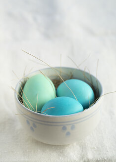 Colored Easter eggs in a bowl - ECF001791