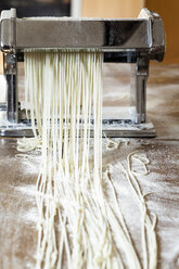 Making linguine in pasta machine - SBDF001757