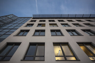 Germany, Munich, facade of office building at evening twilight - ZMF000381