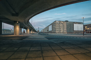 Germany, Brandenburg, view to parking garage of Berlin Brandenburg Airport with underpass in the foreground - ASCF000077