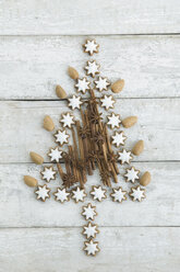 Christmas tree shaped of cinnamon stars, cinnamon sticks, almonds and star anise - ASF005564