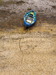 Chile, Puerto Montt, rowing boat lying on sand - STSF000722