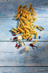 Uncooked Fusilli, chili pods, sage leaves, parmesan and rosmary - CSF025297