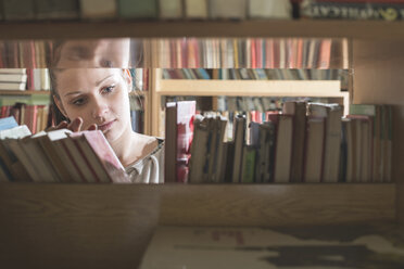 Female student searching books in the library - DEGF000404