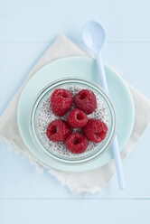 Chia pudding made of chia seeds with almond milk and raspberries - ECF001799