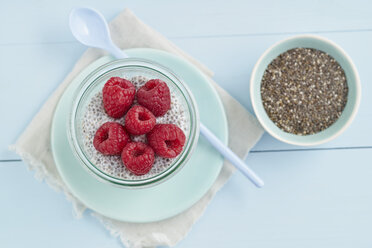 Chia pudding made of chia seeds with almond milk and raspberries - ECF001801