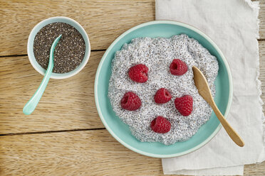 Chia pudding made of chia seeds with almond milk and raspberries - ECF001802