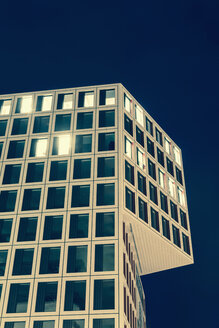 Germany, Stuttgart, office building with some lighted windows in the evening - WDF003077