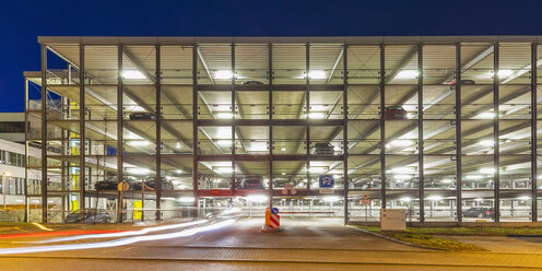 Germany, Stuttgart, lighted parking garage at night - WDF003078