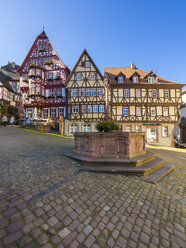 Germany, Bavaria, Miltenberg, half-timbered houses on the market square with fountain - AMF003989