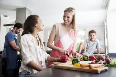 Family preparing food in kitchen - TOYF000043
