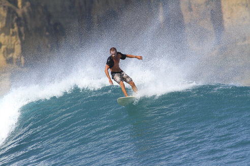 Indonesia, Lombok Island, surfing man - KNTF000010