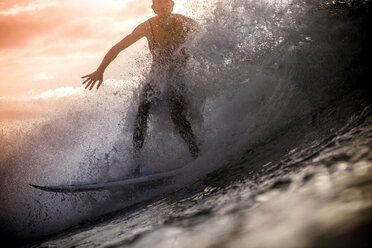 Indonesia, Lombok Island, surfing man at backlight - KNTF000013