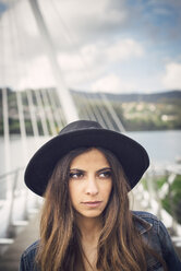 Spain, Ferrol, portrait of young woman wearing black hat - RAEF000148