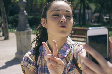 Young woman taking a selfie with smartphone - ABZF000011