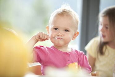 Baby girl eating yogurt - MFRF000209