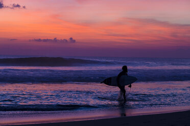 Indonesia, Bali, Surfer at sunset - KNTF000030
