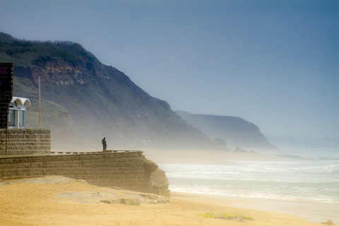 Portugal, Lourinha, Praia da Areia Branca, beach, tourist on viewpoint stock photo