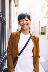 Spain, Barcelona, portrait of smiling woman - EBSF000584