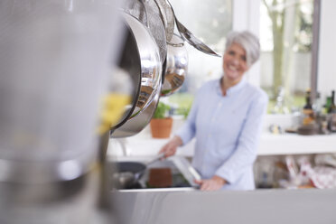 Mature woman in kitchen - FMKF001450