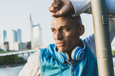 Sportive man with headphones outdoors - UUF004053