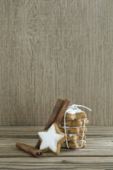 Stack of cinnamon stars and cinnamon sticks - ASF005587