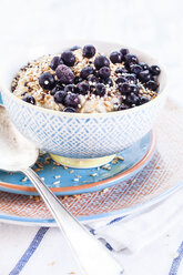 Vegan superfood breakfast with porridge, almond milk, blueberries and roasted quinoa - SBDF001815