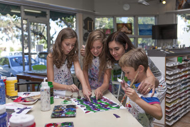 Three children in an art class with their teacher - ZEF006161