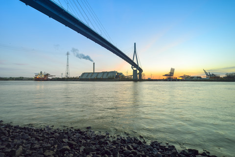 Germany, Hamburg, Koehlbrandbruecke and harbor at sunset stock photo