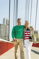 Germany, Mannheim, Mature couple crossing bridge, arms around - UUF004138