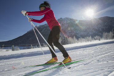 Germany, Bavaria, Inzell, female skier in snow-covered landscape - FFF001447