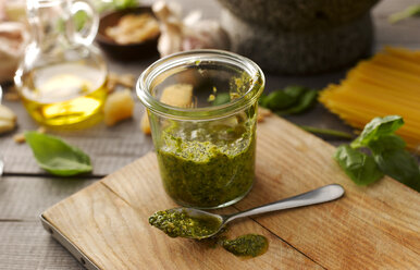 Preserving jar of homemade basil pesto - KSWF001474