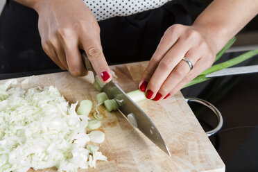 Close-up Of Woman's Hand Chopping Vegetables With Knife In Kitchen Stock  Photo, Picture and Royalty Free Image. Image 56706435.