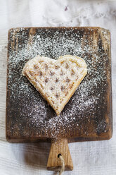 Heart-shaped waffle on cutting board - SBDF001836