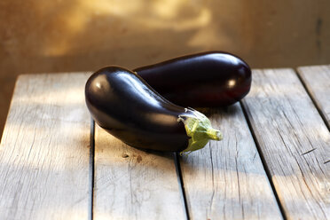 Two aubergines on wood - KSWF001490