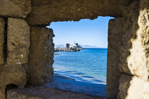 Greece, Rhodes, View through a window at the coast to the okld town - RUNF000016