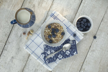 Bowl of granola and blueberries - ASF005589