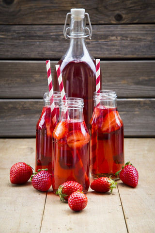 Glass bottles of homemade strawberry lemonade stock photo