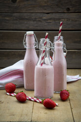 Three swing top bottles of strawberry smoothie - LVF003368