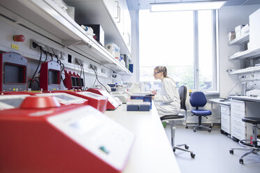 Young female scientist working at biological laboratory - SGF001591