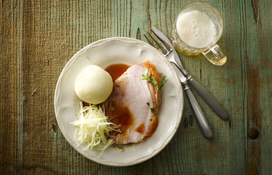 Plate of pork roast with crackling, gravy, white cabbage and dumpling - KSWF001500