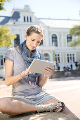 Young woman using digital tablet outdoors - TOYF000527
