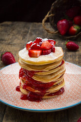 Stack of pancakes with strawberry sauce and strawberries - LVF003370