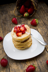 Stack of pancakes with strawberry sauce and strawberries - LVF003373