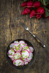 Organic radish salad in bowl with chives - LVF003378